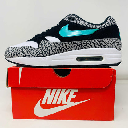 Nike Air Max 1 atmos Elephant 2017 sneaker on box with elephant print and turquoise swoosh.