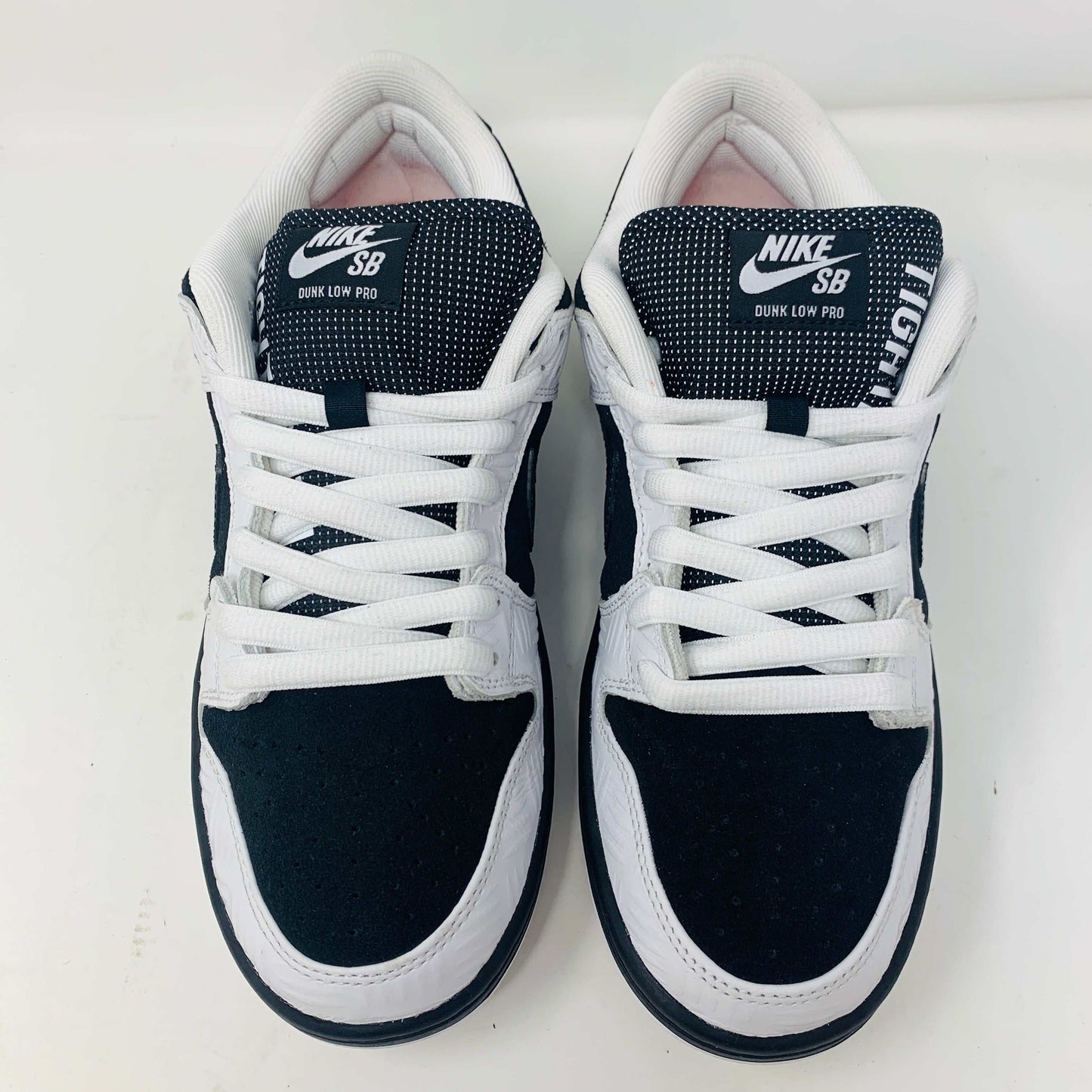 Nike SB Dunk Low TIGHTBOOTH sneakers size 9M, lightly worn, black and white with extra laces.