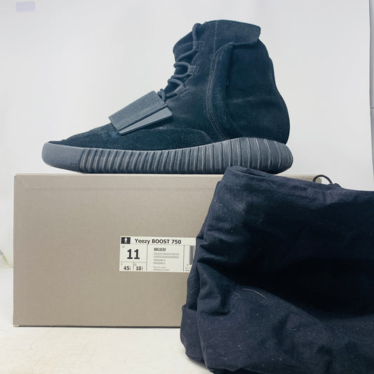 Yeezy Boost 750 Triple Black sneakers, size 11M, lightly worn, with box and accessories, 2015 release.