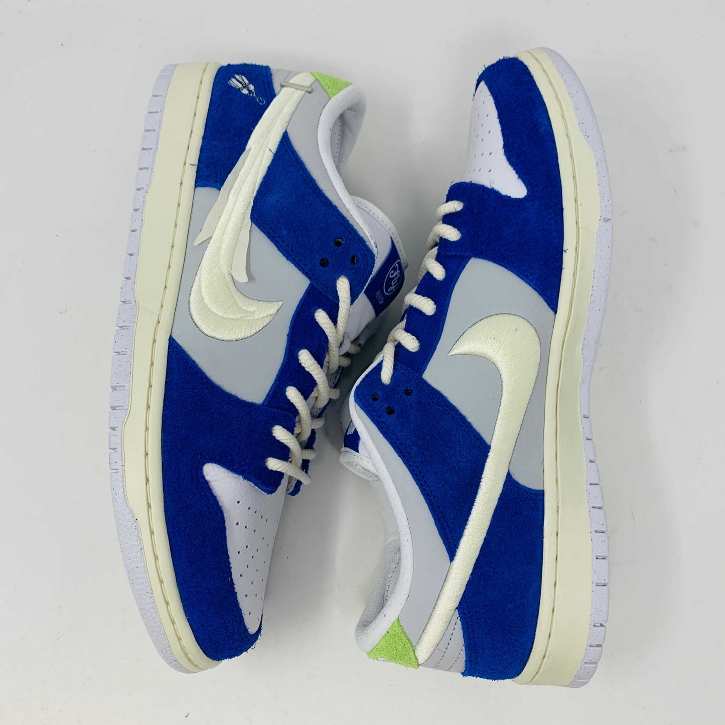 Nike SB Dunk Low Pro Fly Streetwear Gardenia sneakers, blue and white colorway.