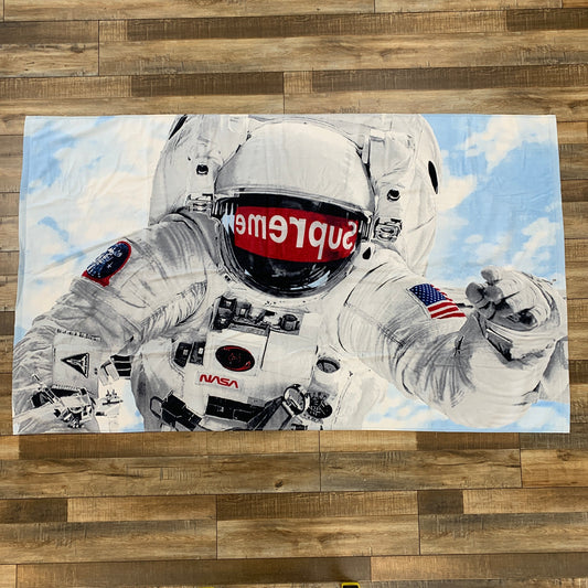 Supreme Astronaut Beach Towel Multi with astronaut graphic design.