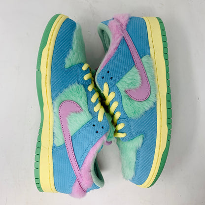 Brand new Nike SB Dunk Low Verdy Visty sneakers with blue, green, and pink fuzzy textures showcase pink swooshes, yellow laces, and green soles against a light gray background.