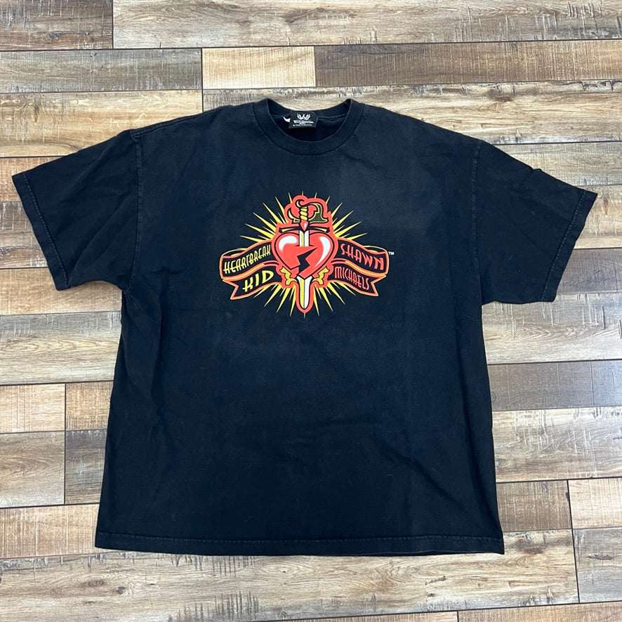 Shawn Michaels WWE Tee Black XXL preowned shirt on wooden floor.