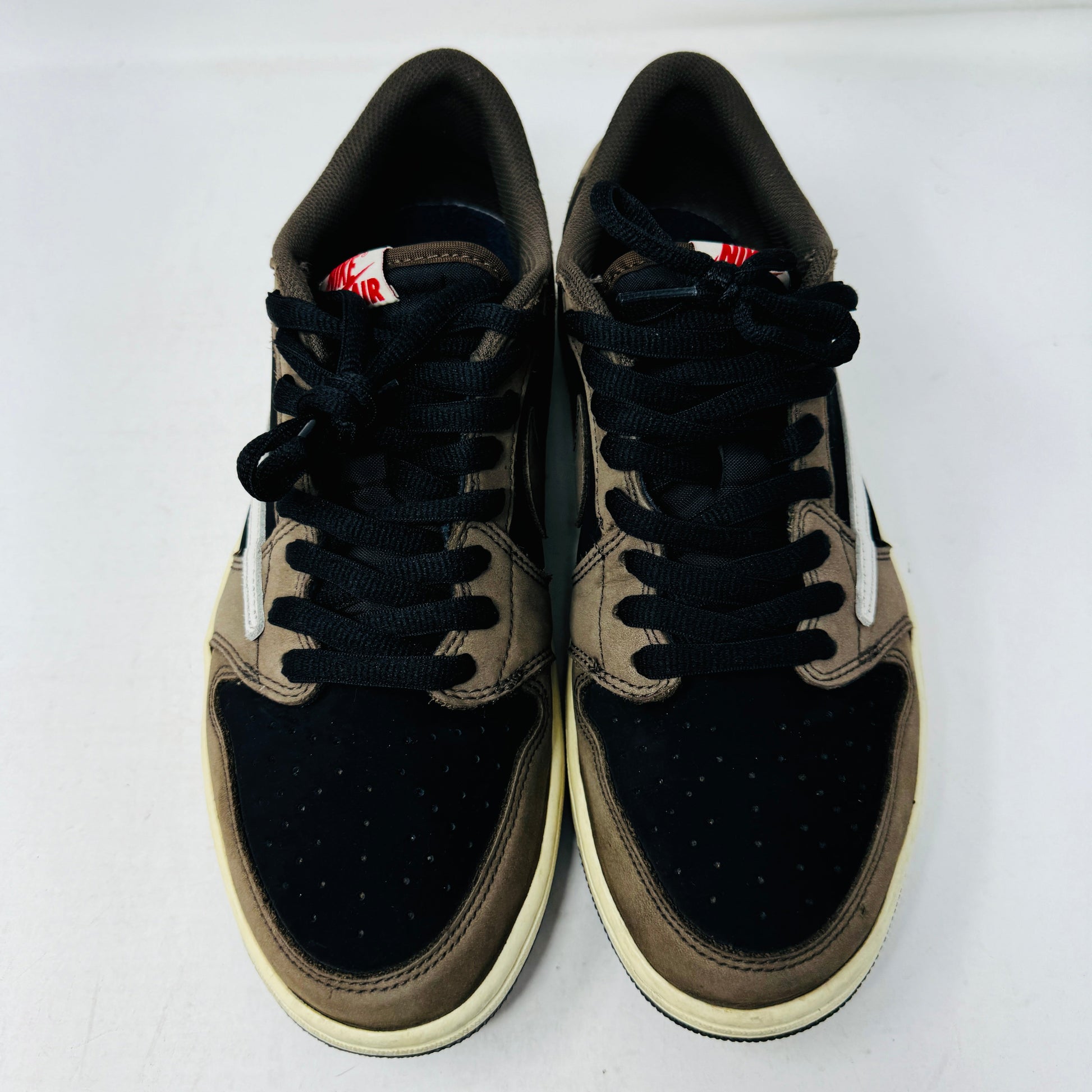 Jordan 1 Retro Low OG SP Travis Scott Mocha sneakers, size 10.5M, 2019 model, with clean uppers and suede faded.