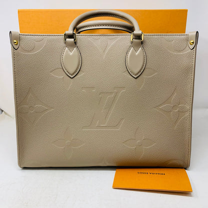 Louis Vuitton Onthego Tote PM in Tourterelle Beige Cream Leather with Monogram Empreinte pattern, brand new with box and dust bag.