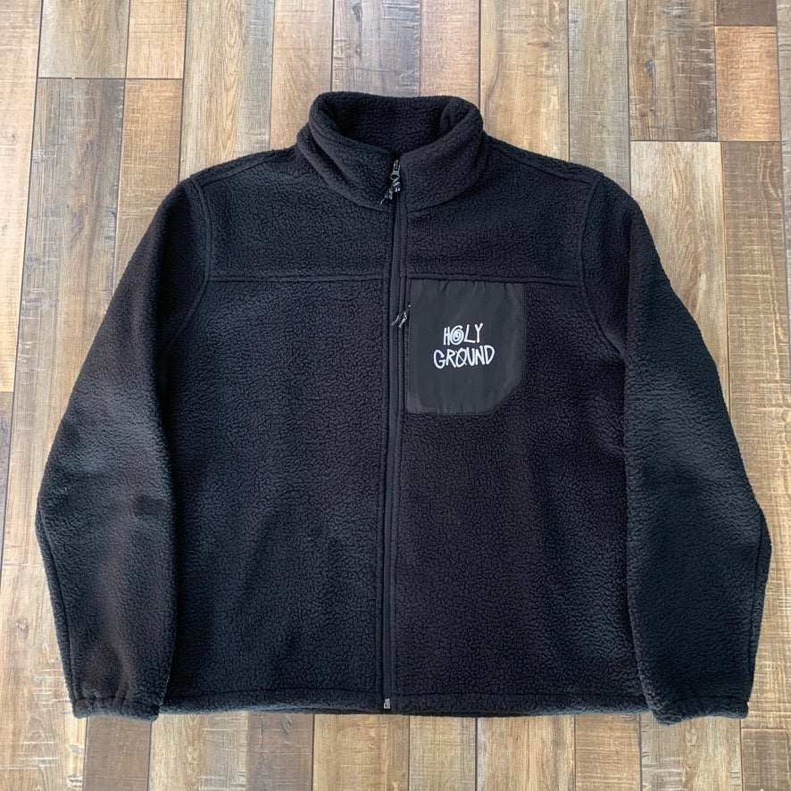 Holy Ground Stussy Fleece Black with logo, warm and stylish for any occasion.