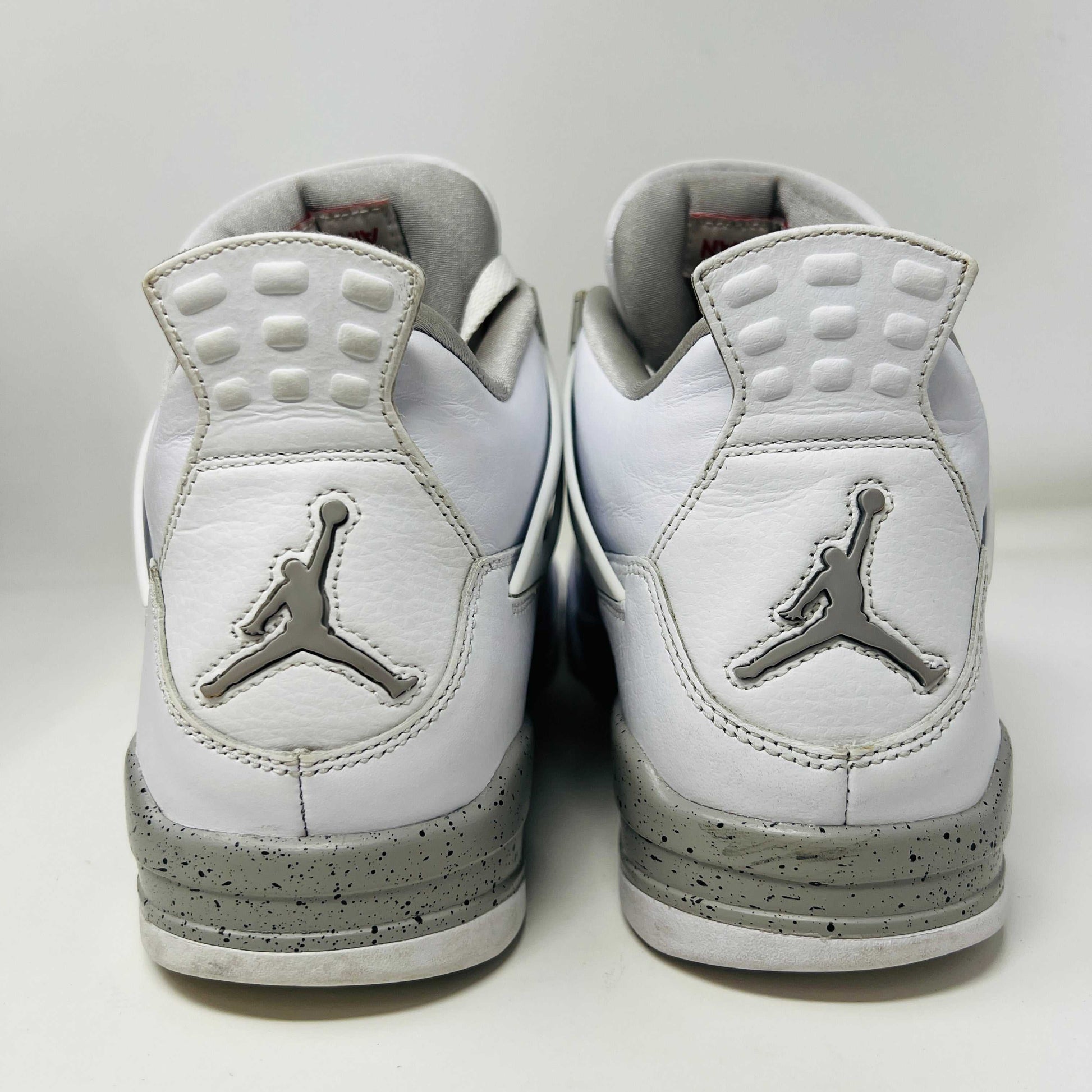 Jordan 4 Retro White Oreo 2021 sneakers, size 11, lightly worn, rear view showing Jumpman logo and white design.