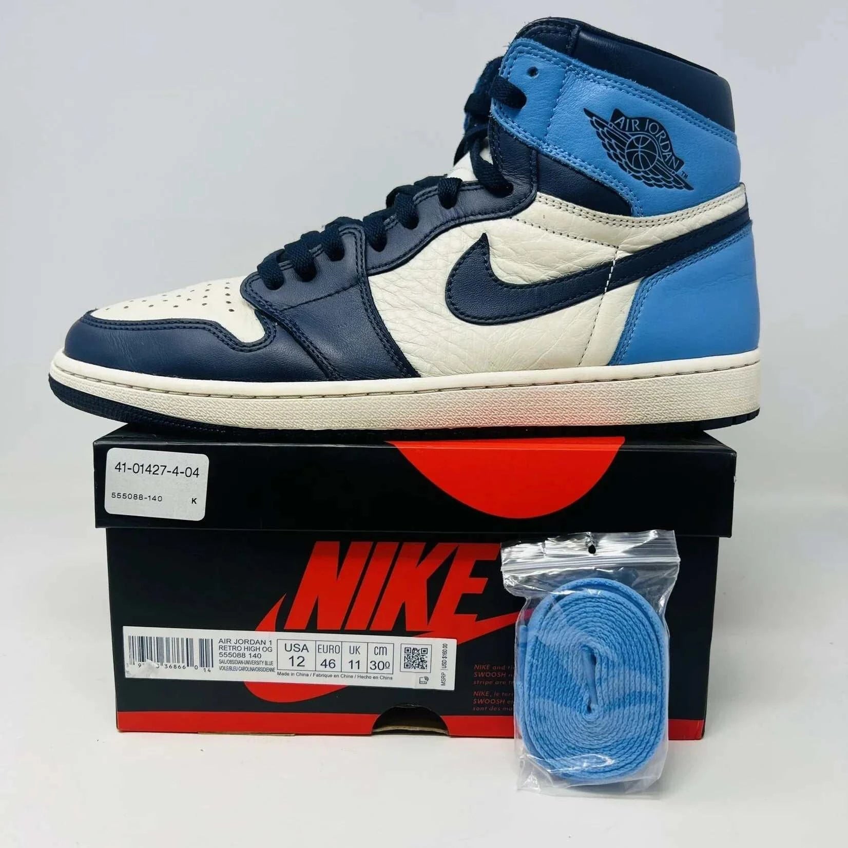 Jordan 1 Retro High Obsidian sneakers with box and blue laces, condition 8.5/10.