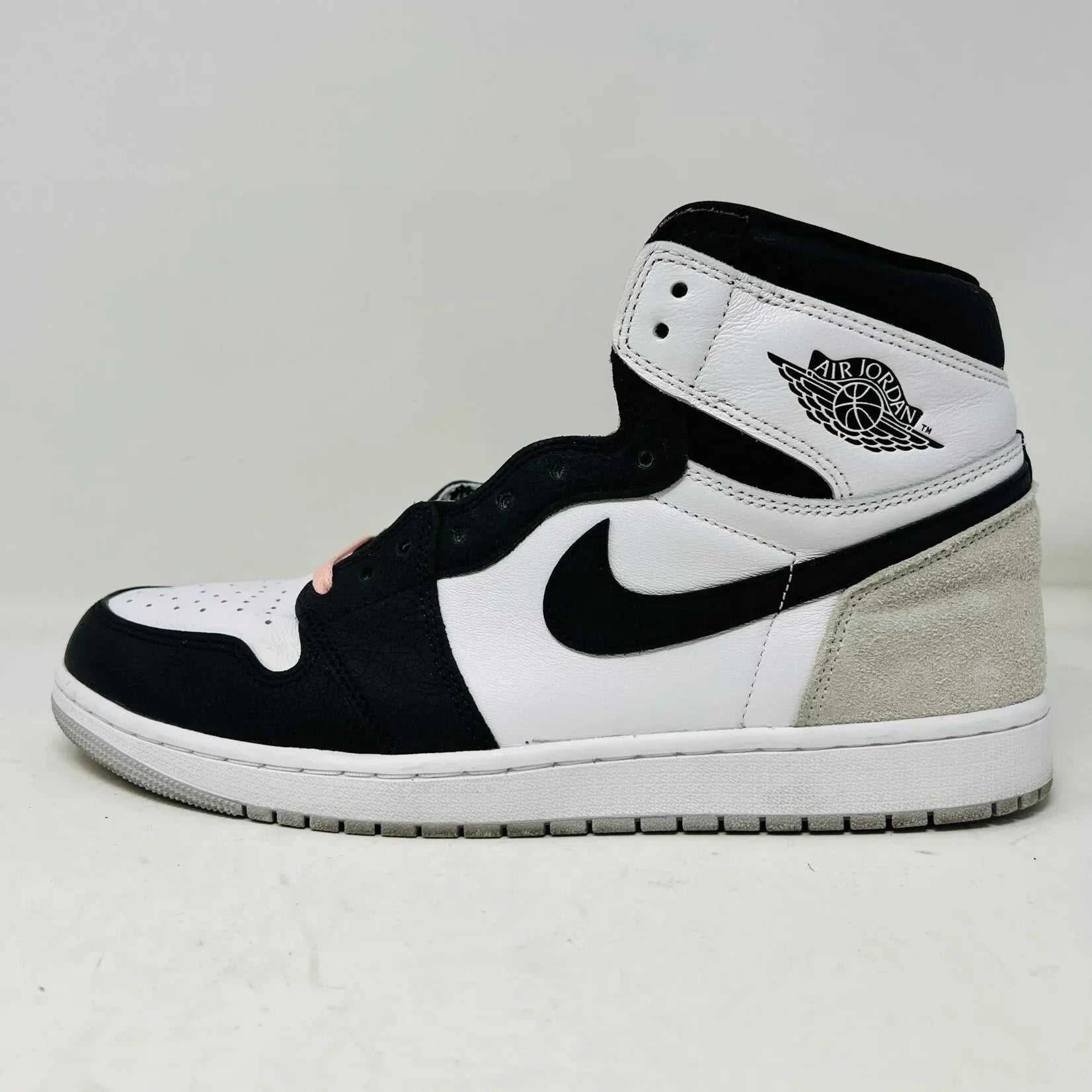 Jordan 1 Retro High OG Bleached Coral sneaker, black and white design, side view.