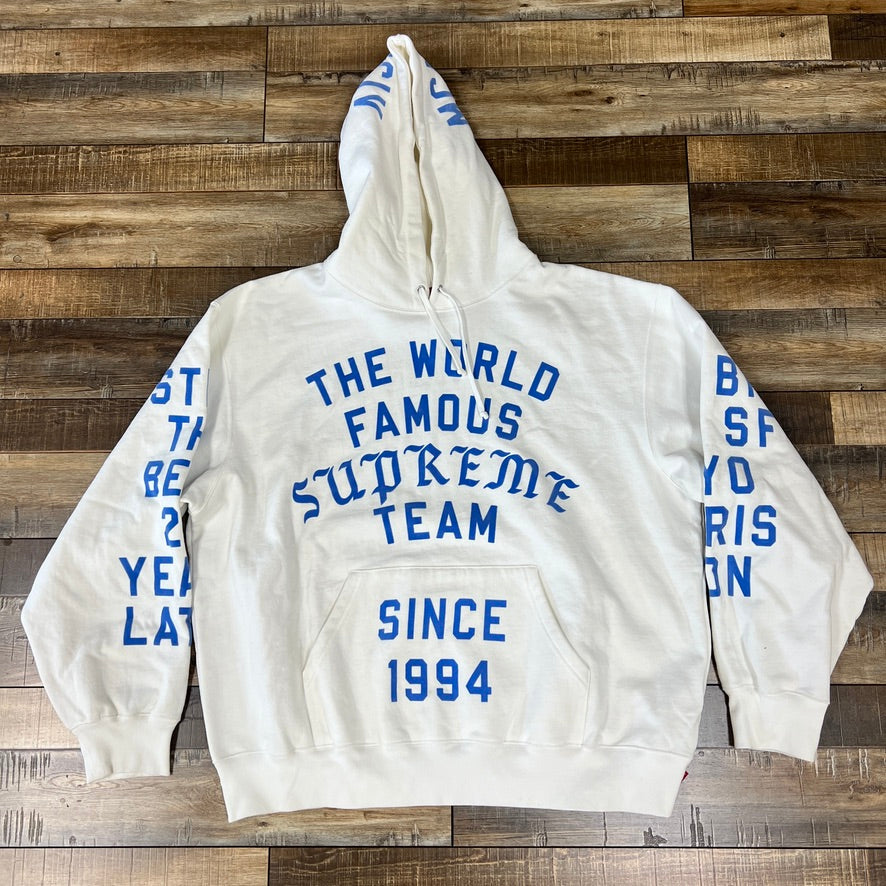 Supreme Team Flocked Hooded Sweatshirt White with blue lettering on front and sleeves.