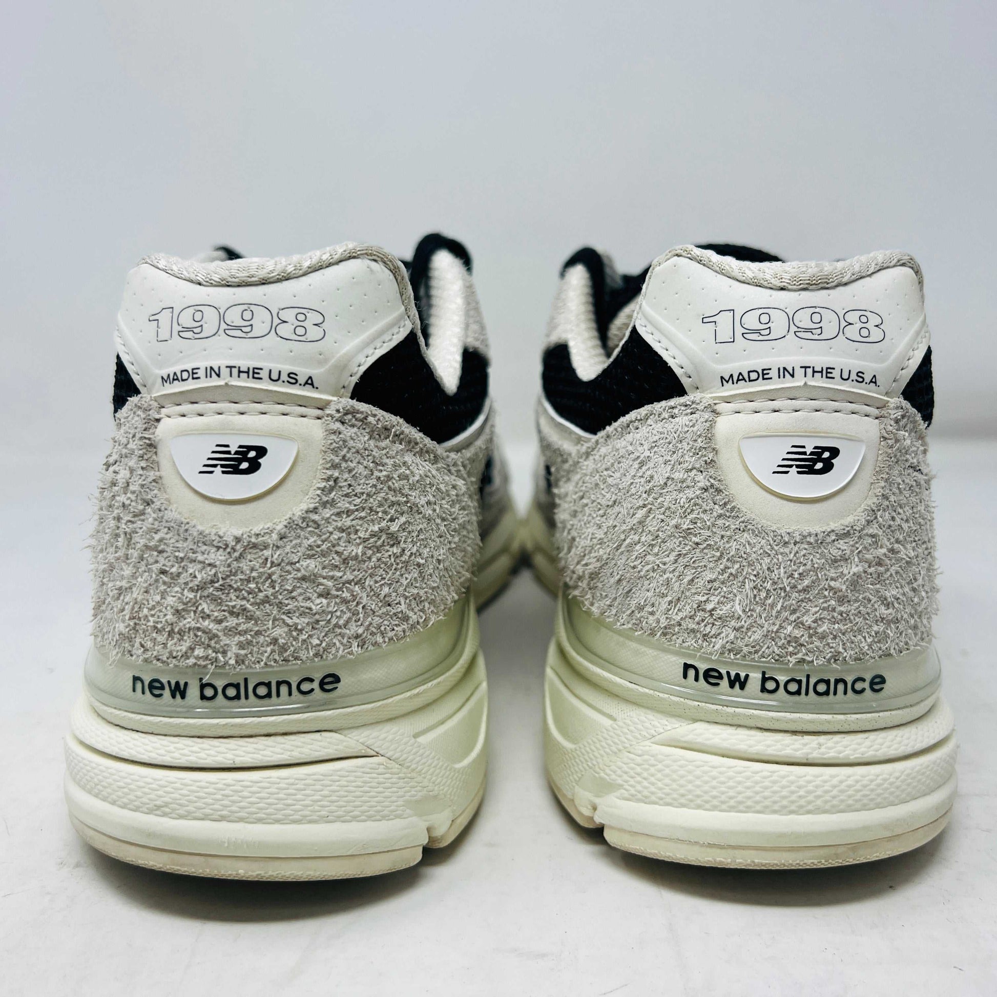 New Balance 990v4 MiUSA Joe Freshgoods 1998 Intro sneakers, size 10, condition 8/10, with extra laces, back view display.