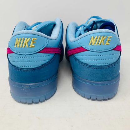 Nike SB Dunk Low Run The Jewels sneakers in blue with gold logo detailing.