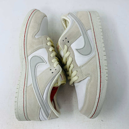 Nike SB Dunk Low City of Love Light Bone sneakers with red and blue accents, premium leather upper, and Zoom Air cushioning.