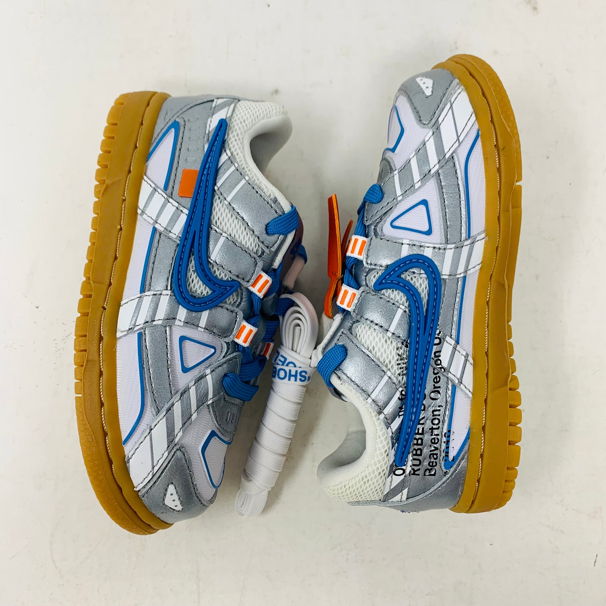 Nike Air Rubber Dunk Off-White University Blue toddler shoes with rubber sole and iconic Off-White logo.