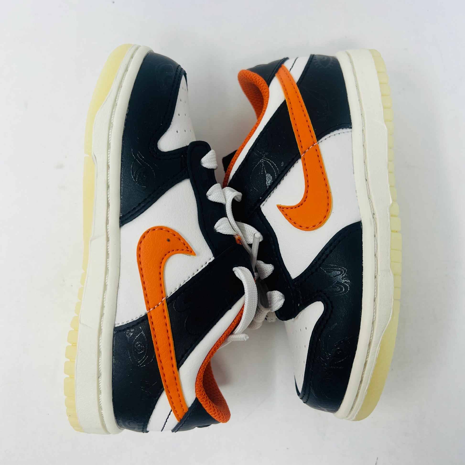 Nike Dunk Low PRM Halloween 2021 TD sneakers in black, white, and orange.