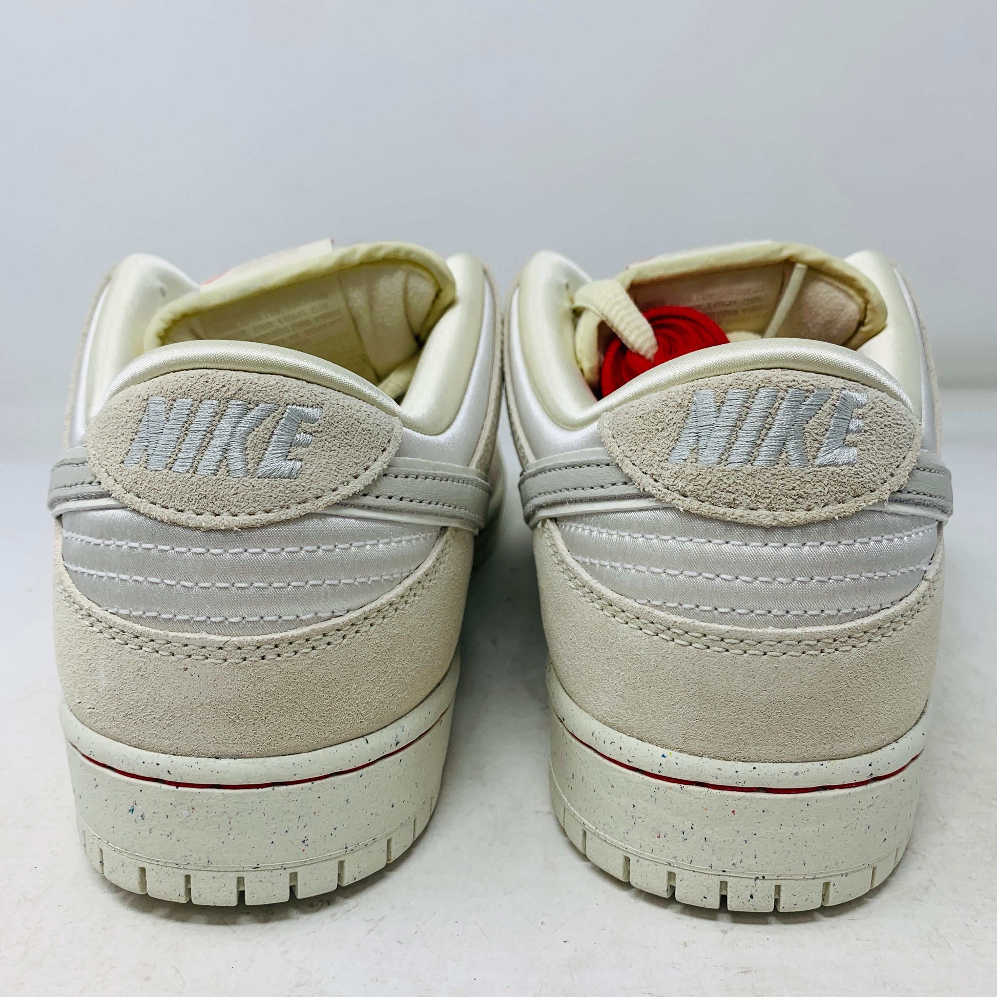 Nike SB Dunk Low City of Love Light Bone sneakers with light bone colorway and red accents.