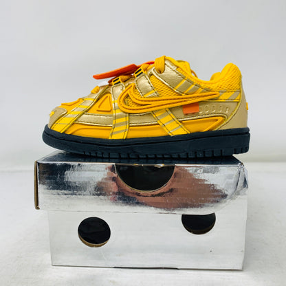 Nike Air Rubber Dunk Off-White University Gold TD sneaker for toddlers with yellow and black design on box.