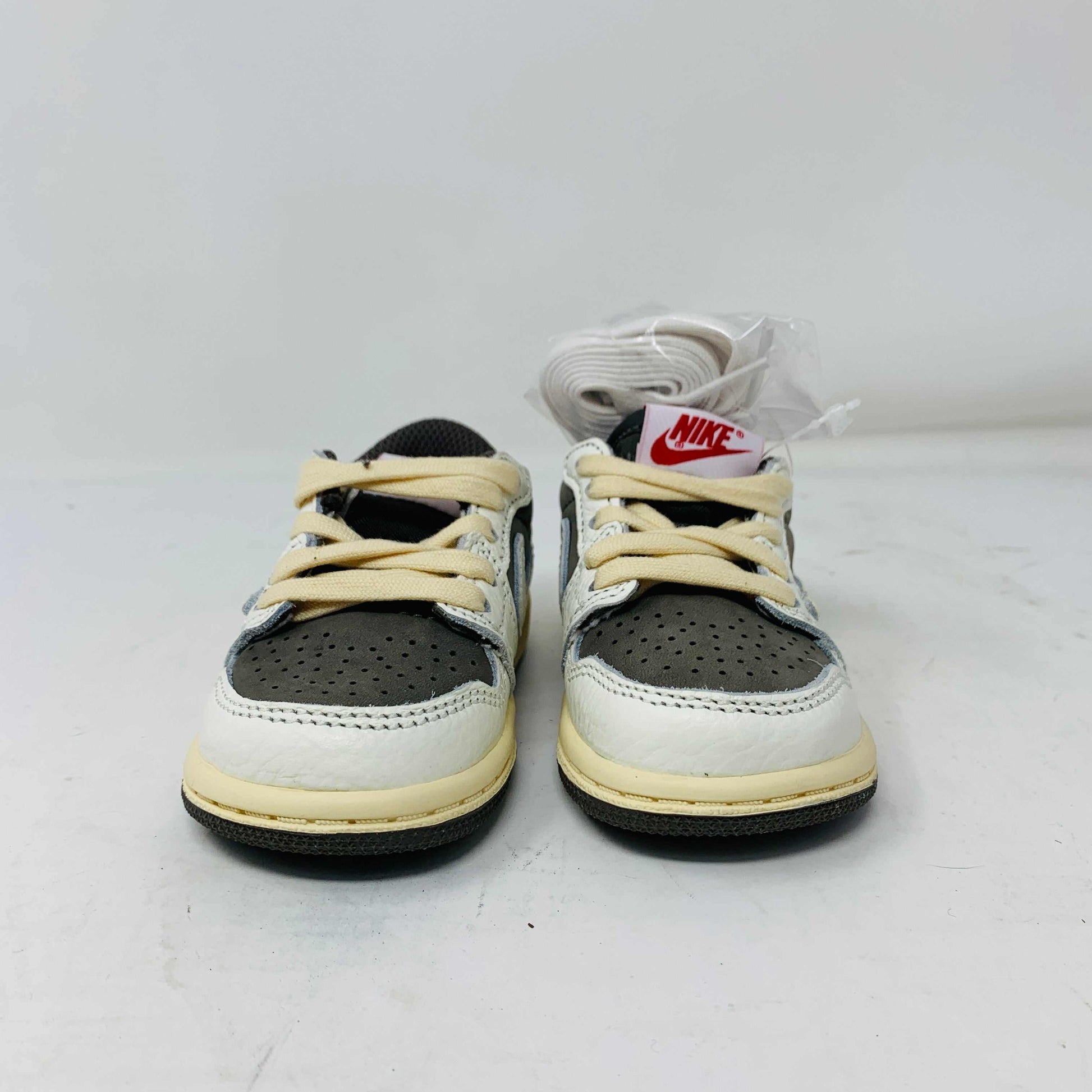 Jordan 1 Low TS Reverse Mocha TD toddler sneakers in reverse mocha colorway.