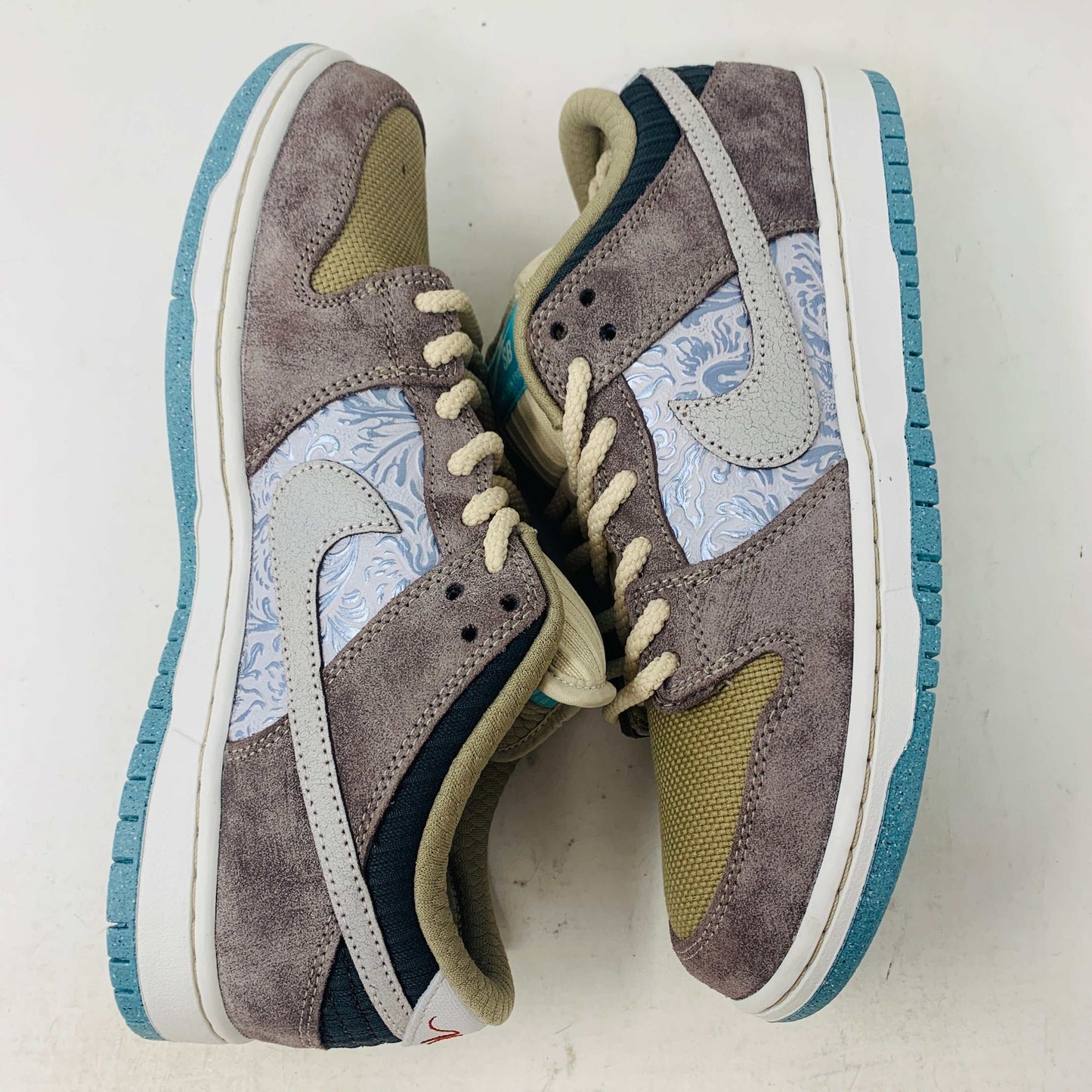 Nike SB Dunk Low Big Money Savings sneakers with suede and patterned details.