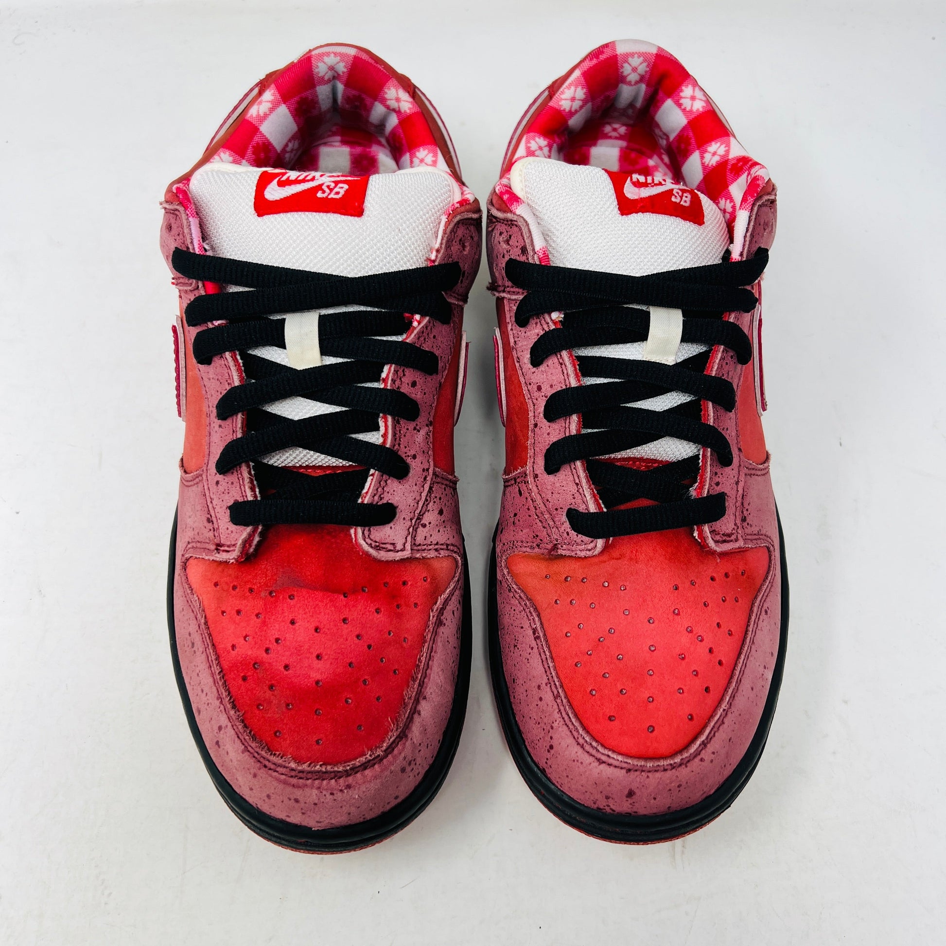 Nike SB Dunk Low Concepts Red Lobster, size 9.5M, lightly worn with discolored toe box, 2008 release.