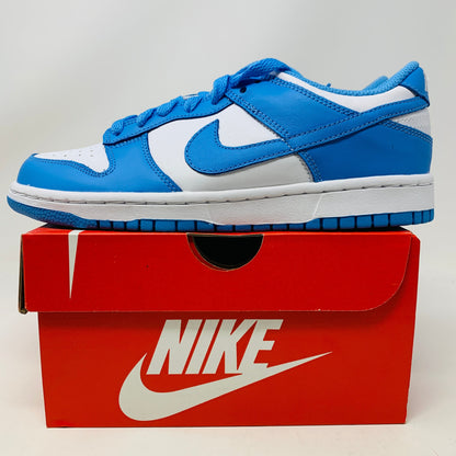 Nike Dunk Low UNC GS sneakers on a red Nike box, brand new condition.