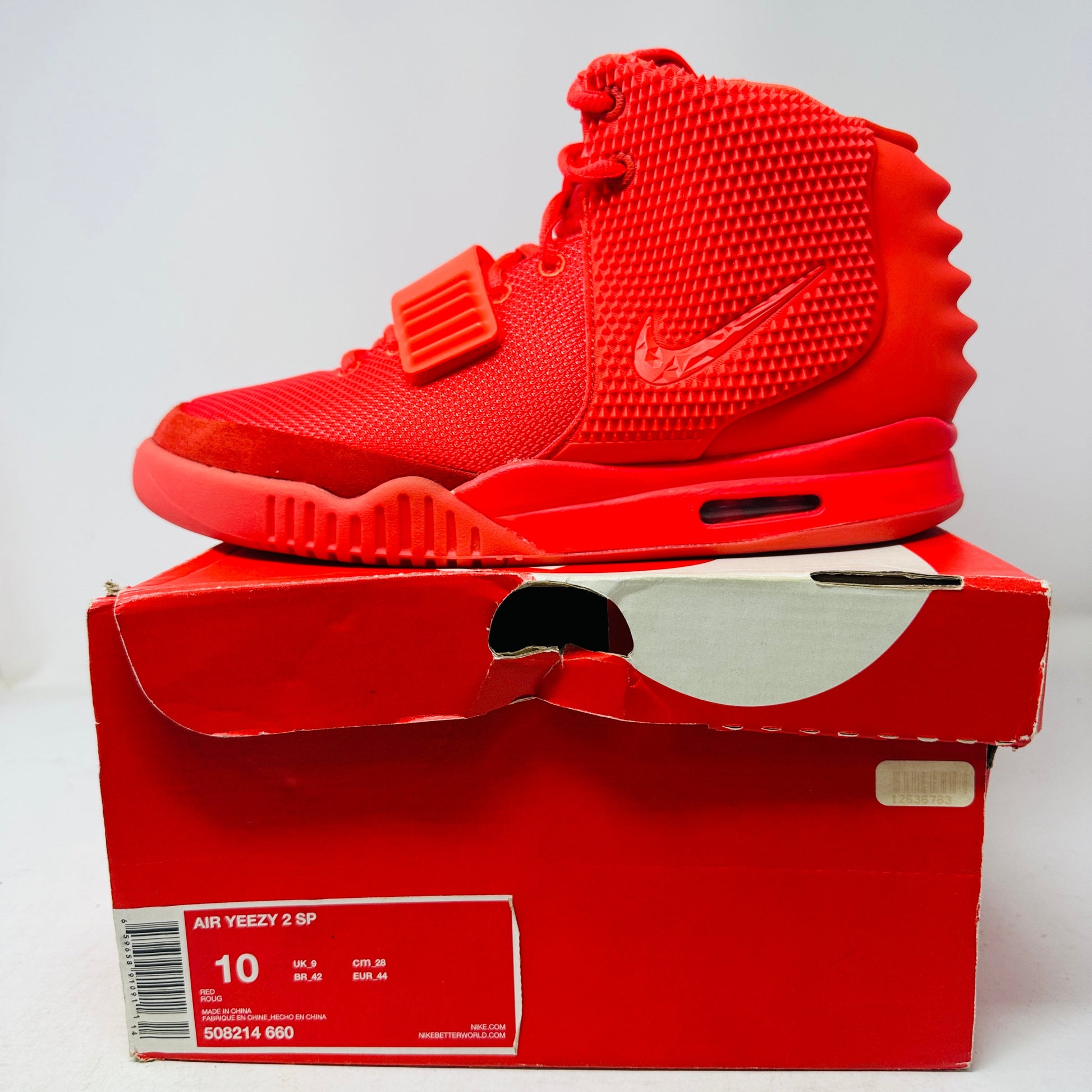 Nike Air Yeezy 2 Red October sneakers, size 10M, brand new in slightly damaged box, includes dustbag, 2014 release.