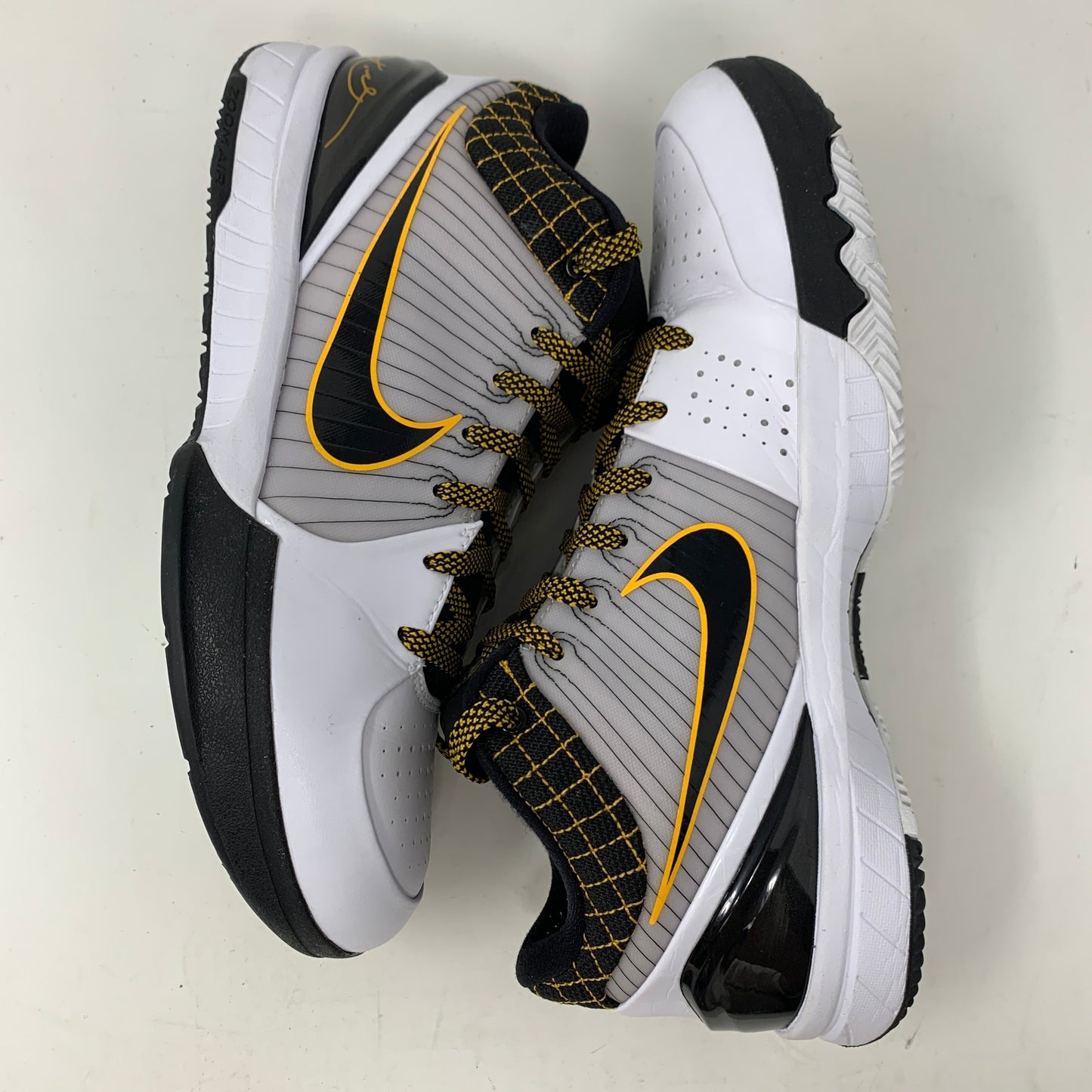 Nike Kobe 4 Protro White Black Del Sol sneakers, 2019 model, clean uppers, durable outsoles.