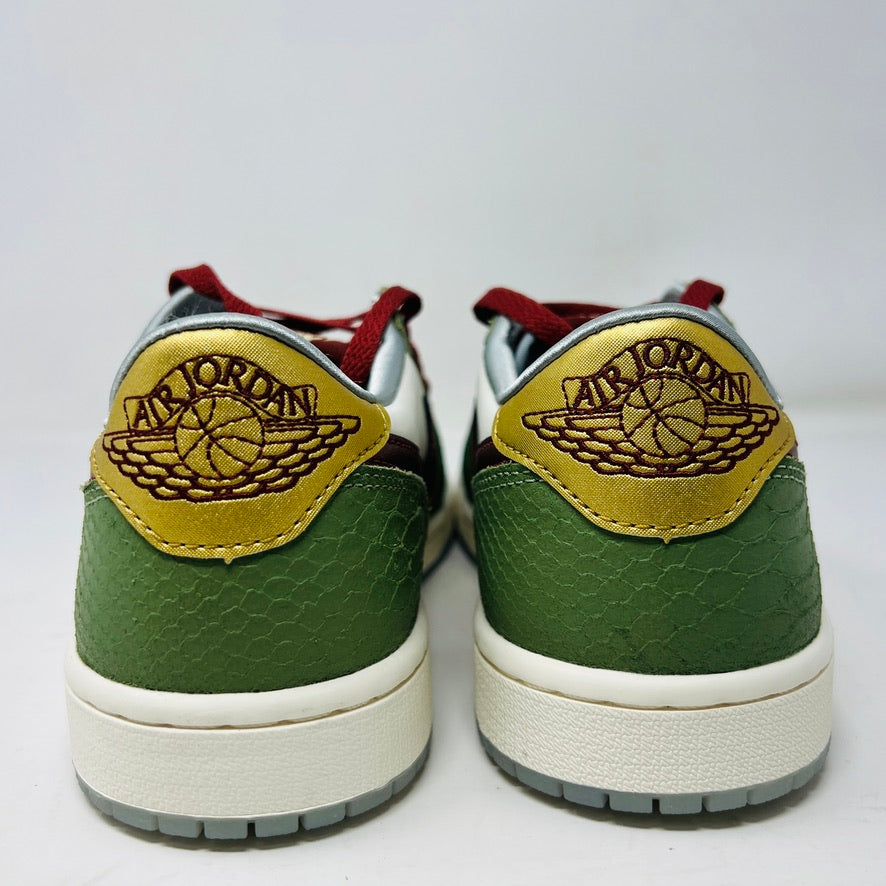 A pair of Jordan 1 Retro Low OG Year of the Dragon (2024) sneakers featuring green heels, gold accents, and burgundy details with the Air Jordan logo embossed in brown on the gold backs. They also have white midsoles and grey outsoles.