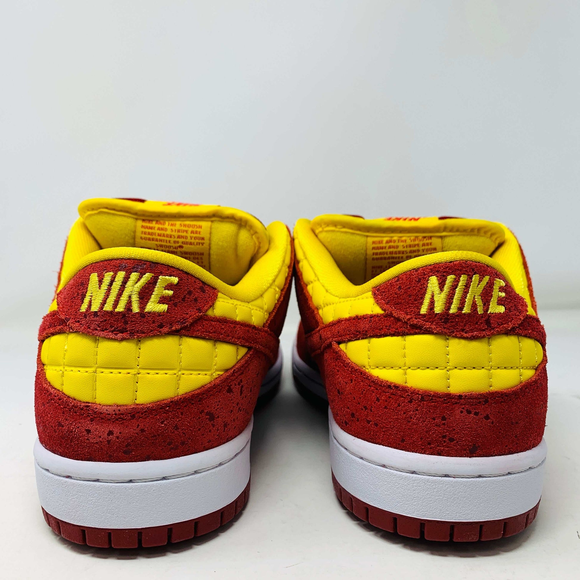 Nike SB Dunk Low Rukus Crawfish sneakers with red and orange textured upper.