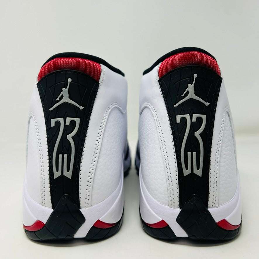 Jordan 14 Retro Black Toe 2024 sneakers with black, white, and red accents, featuring Jumpman logo and Zoom Air technology.