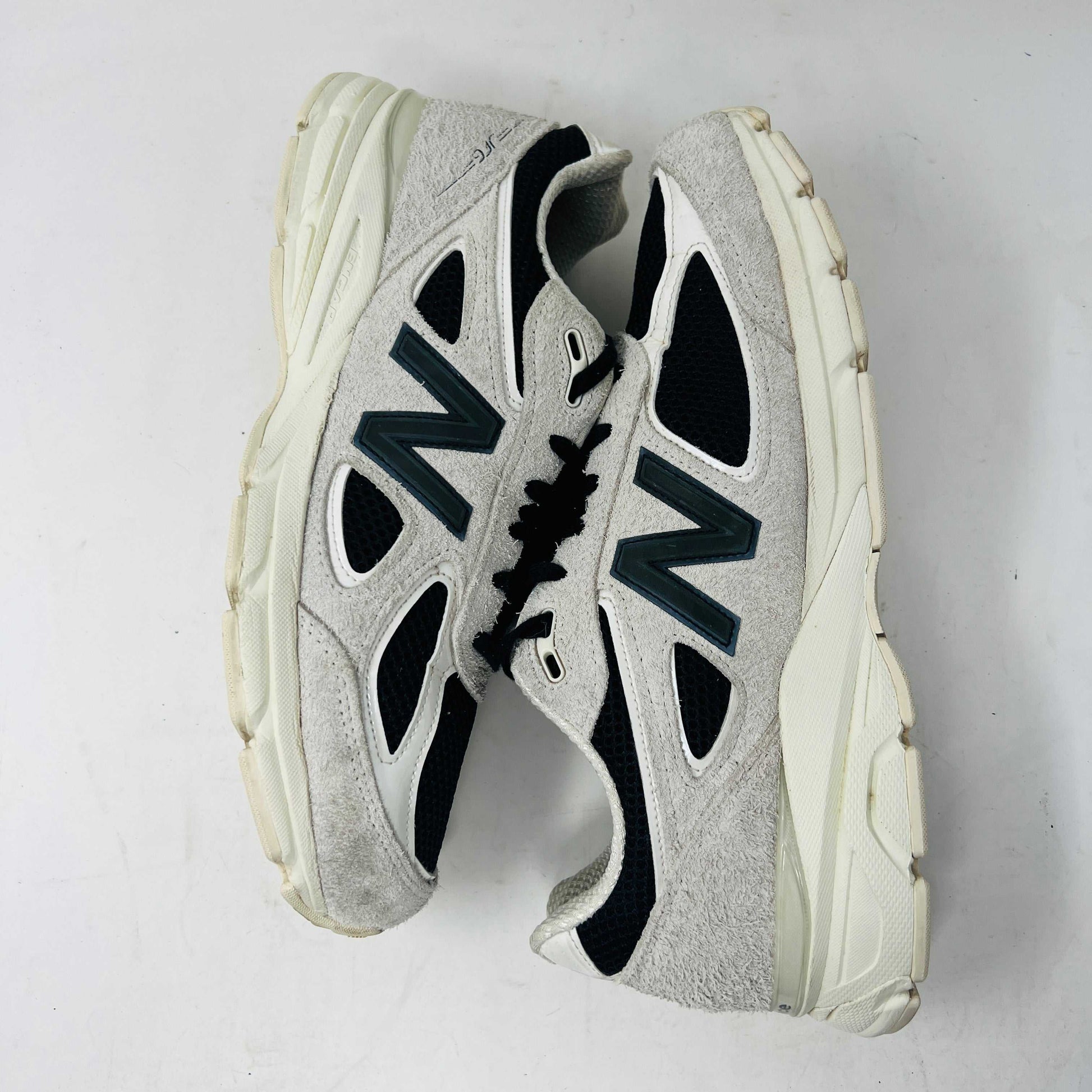 New Balance 990v4 MiUSA Joe Freshgoods 1998 Intro sneakers with wear on uppers and soles, size 10, extra laces included.