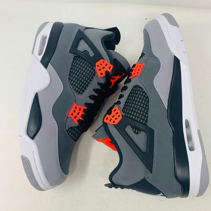 A pair of Jordan 4 Infrared sneakers by Jordan, featuring a gray mesh panel, black laces, and red accents with a distinctive logo on the tongue. They are positioned side by side on a white surface against a plain background.