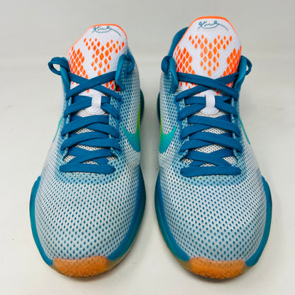 The Kobe 10 GS High Dive from Nike, in size 7Y, is on display with a blue upper, gradient yellow-green Swoosh, orange lining, and a multicolored sole. Its resting on its black box and shows normal wear.