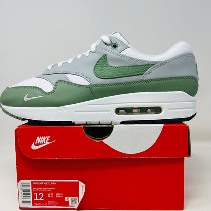 Nike Air Max 1 Spiral Sage sneakers on Nike box, 2020 release.