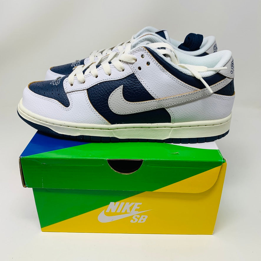 Nike SB Dunk Low HUF New York City sneakers in white and navy with original box, 2022 model.