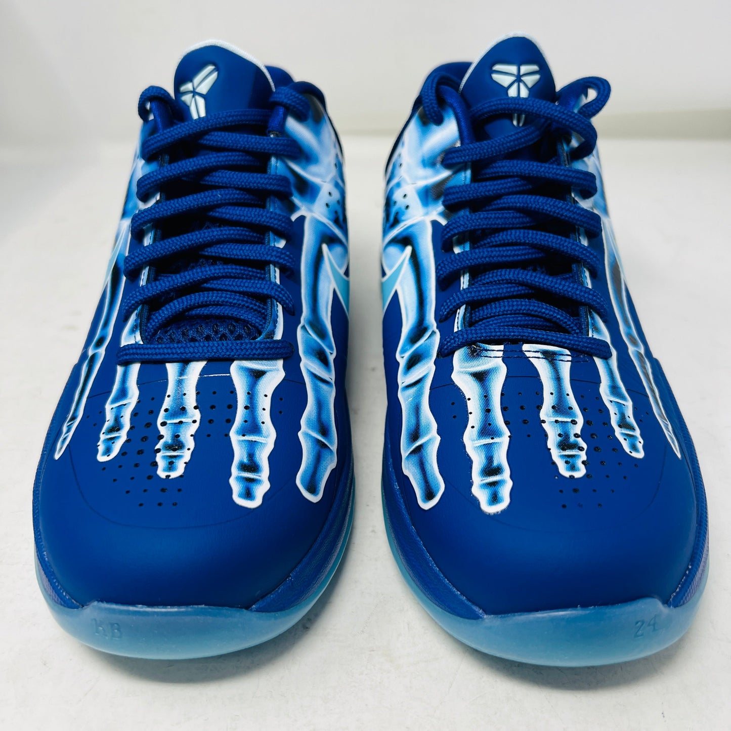 Nike Kobe 5 X-Ray (GS) sneakers in blue with skeletal design.