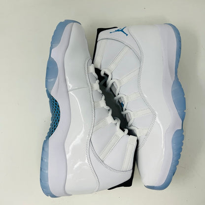 Jordan 11 Retro Legend Blue (2024) sneaker with white patent leather and icy blue sole.