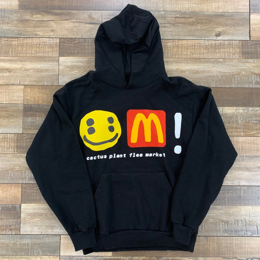 Black hoodie featuring Cactus Plant Flea Market x McDonald's graphics.