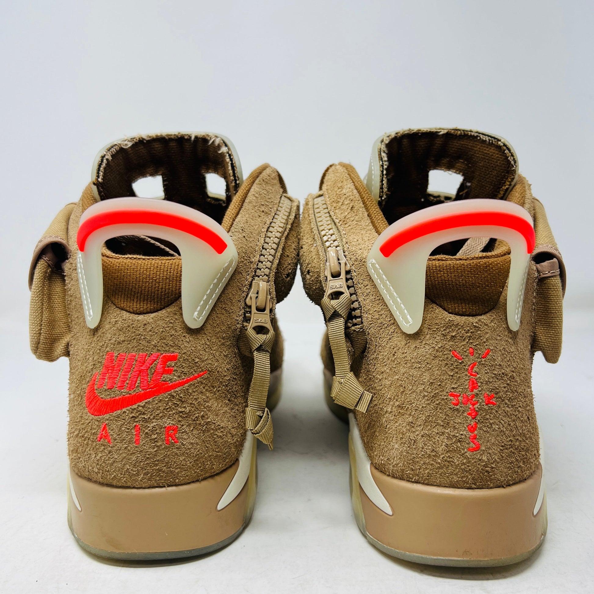 Jordan 6 Retro Travis Scott British Khaki sneakers, 2021 edition, brown suede with red accents, condition 8.25/10, includes extra laces.