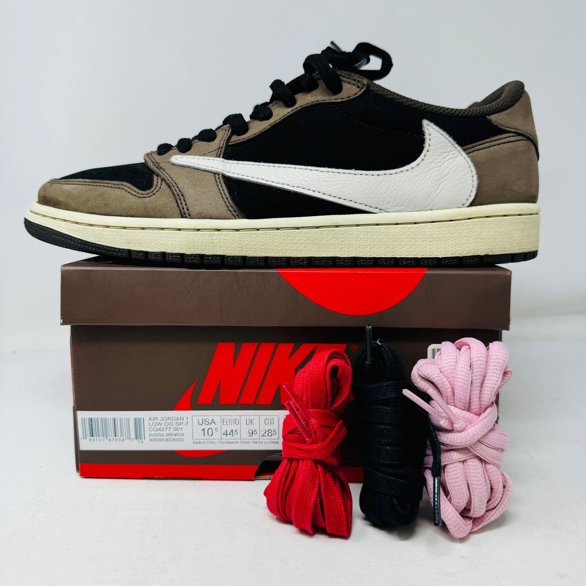 Jordan 1 Retro Low OG SP Travis Scott Mocha sneakers with box and extra laces.