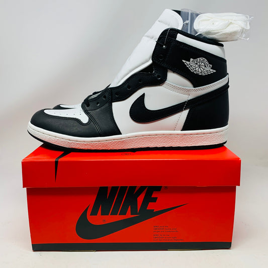 Jordan 1 Retro High 85 Black White 2023 sneakers on box with extra laces.