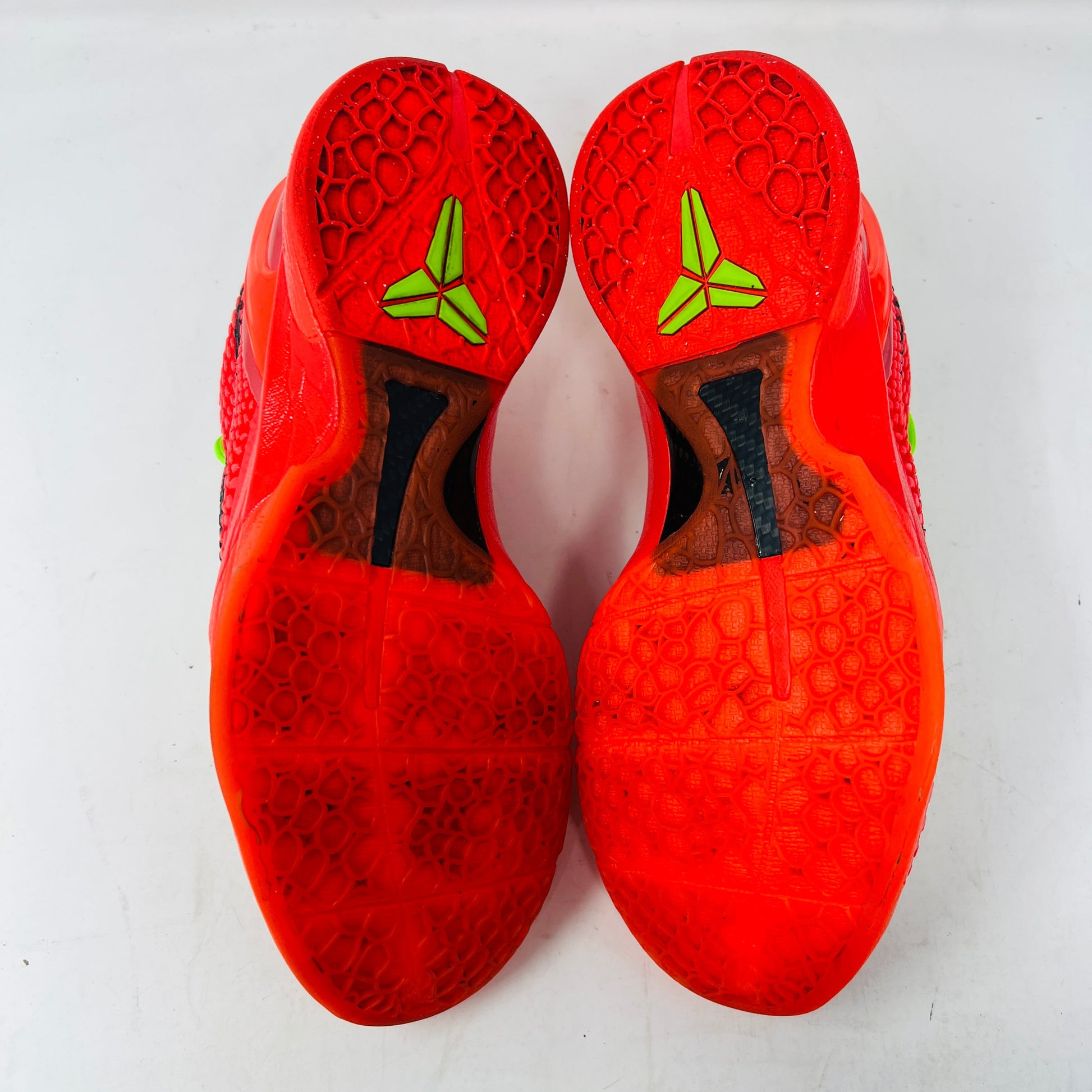 Nike Kobe 6 Protro Reverse Grinch bright red soles with green logo detailing.