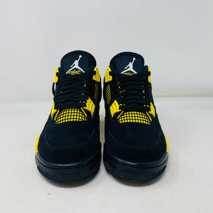 Jordan 4 Thunder 2023 brand new sneakers with black and yellow design.