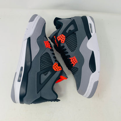 A pair of Jordan 4 Infrared sneakers by Jordan, featuring a gray mesh panel, black laces, and red accents with a distinctive logo on the tongue. They are positioned side by side on a white surface against a plain background.