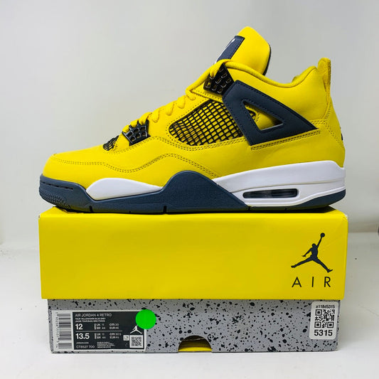 Jordan 4 Retro Lightning 2021 sneakers on box, condition 9/10.