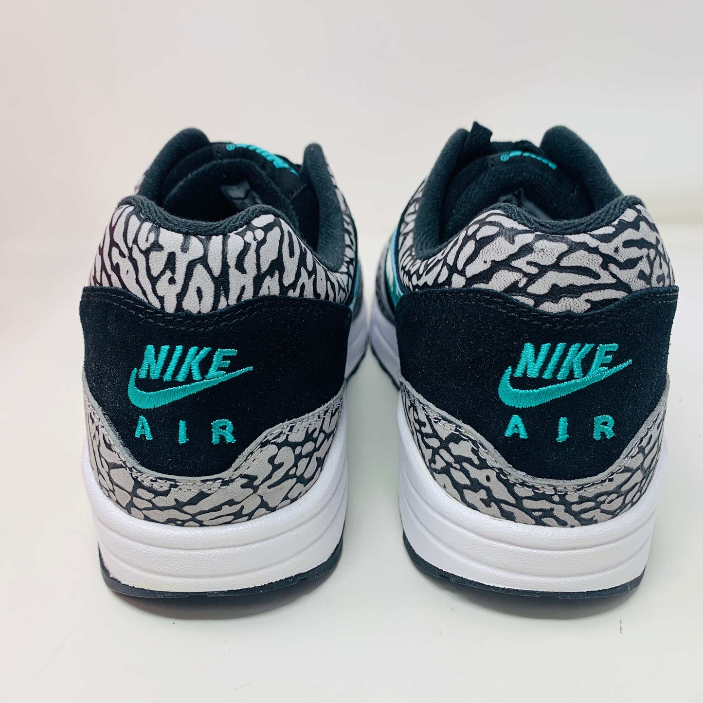 Nike Air Max 1 atmos Elephant 2017 sneakers with elephant print and teal swoosh.