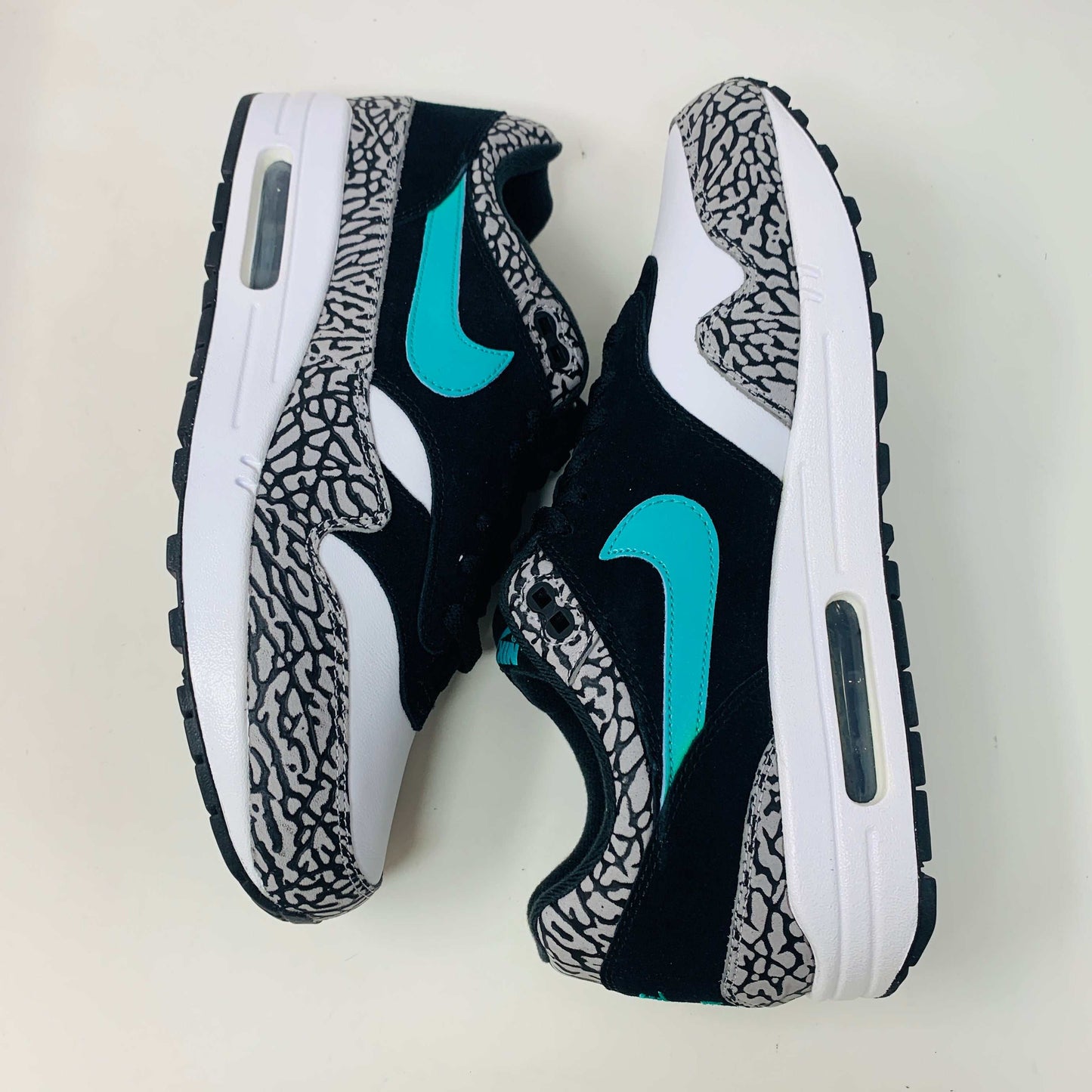 Nike Air Max 1 atmos Elephant 2017 sneaker with elephant print and teal swoosh.