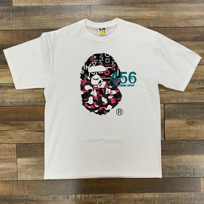 BAPE x Squid Game Ape Head Tee White, brand new condition with unique graphic design on front.