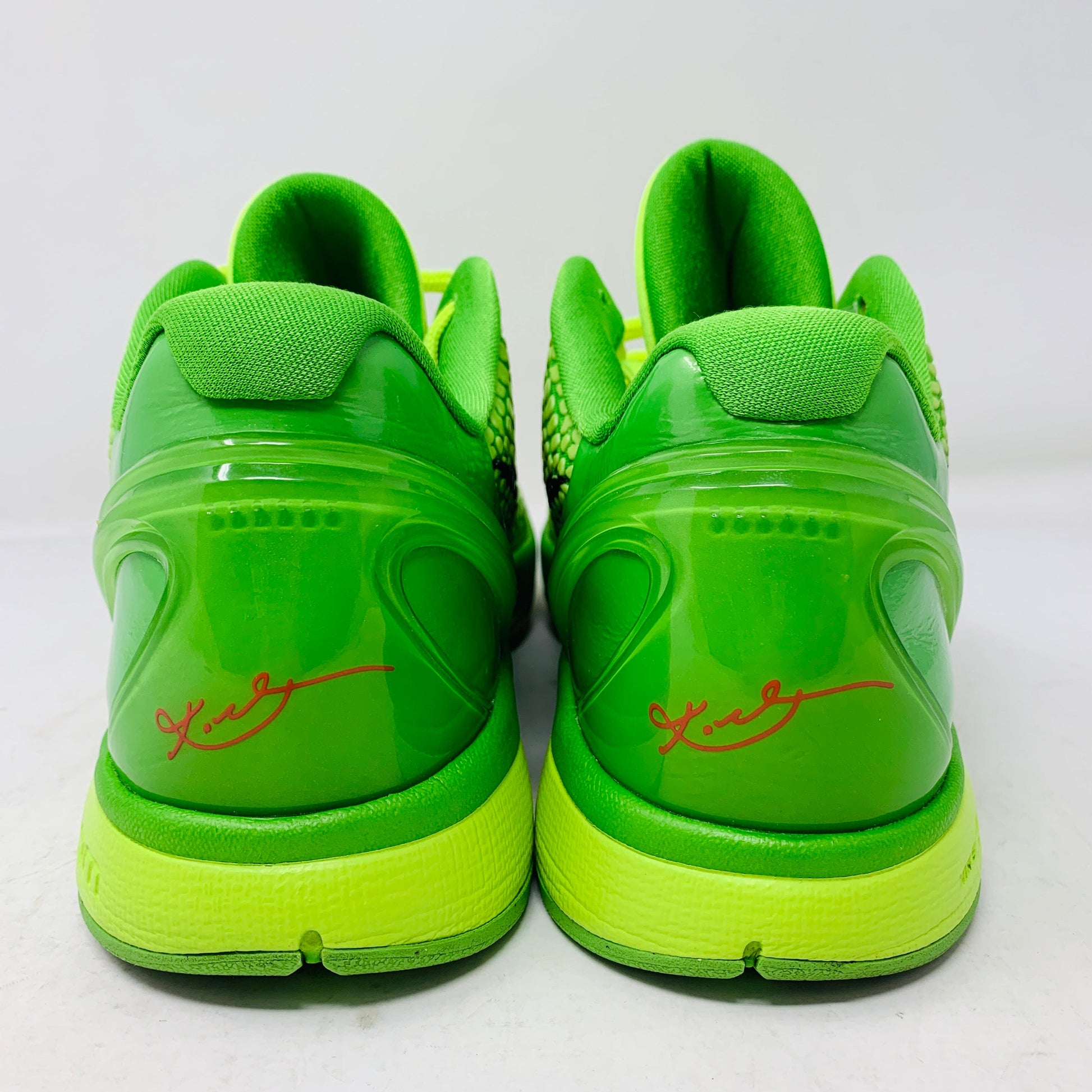 Nike Kobe 6 Grinch 2010 sneakers with slight yellowing, clean condition, no accessories.