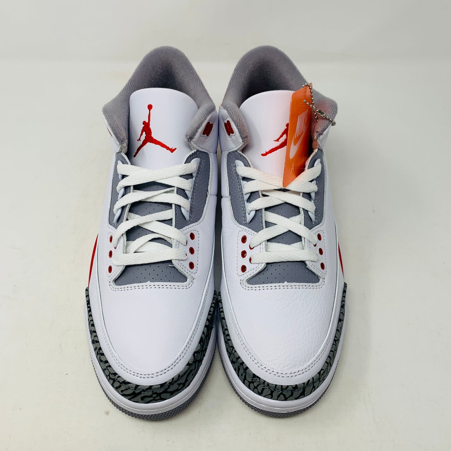 Jordan 3 Fire Red 2022 sneaker with white leather and red accents.